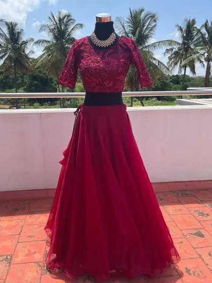 A full view of the elegant wine-red lehenga, perfect for an evening party.