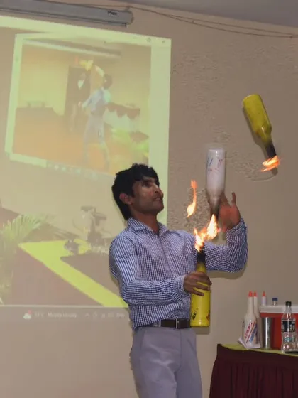 Juggling fire is part of the spectacle we can bring to your event. This shot from a workshop captures the excitement and skill involved in our fire flair shows.