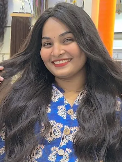 Pure joy. This client is showing off her full, healthy-looking hair after getting her extensions.