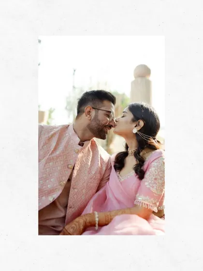 A sweet and simple moment of the couple sharing a kiss. The white border gives this photo a classic, timeless feel, like a cherished memory.