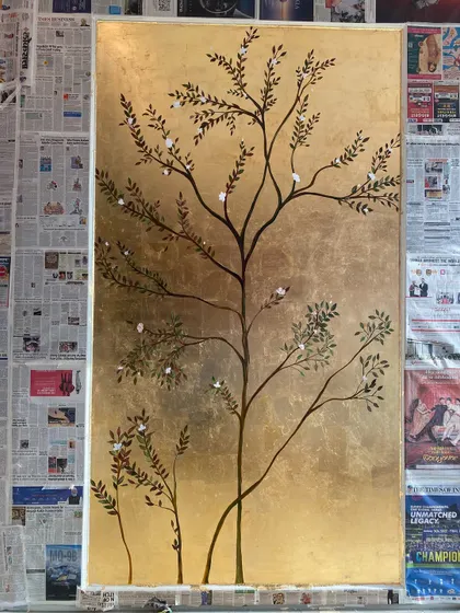 The full mural during the creation process, with the surrounding walls still protected by newspaper. This gives a sense of the work and precision involved.