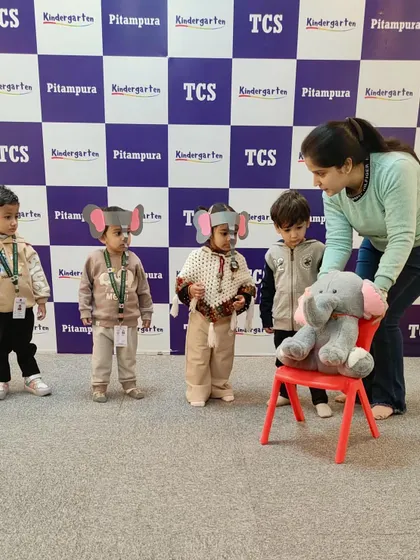 The Elephant March in progress. To learn the letter 'E', our Red Caterpillar class participated in a fun march and dance, sparking creativity and imaginative role-play.