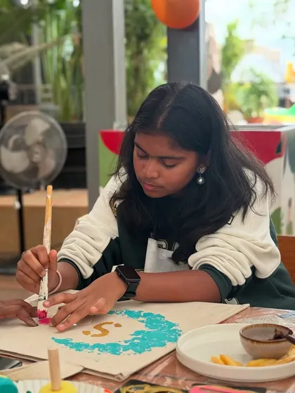 Another young artist focused on her tote bag creation. The use of stencils helps ensure a great result every time.