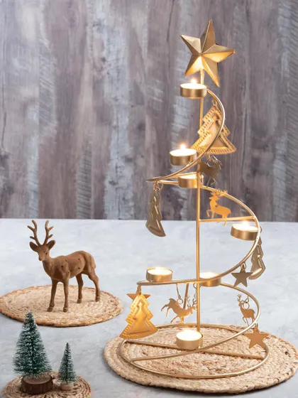 My brushed gold spiral Christmas tree stand is a showstopper. It holds multiple tea light candles and is adorned with little reindeer and tree charms.