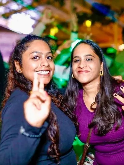 Guests flashing peace signs and enjoying the party. The positive energy of the crowd fuels my performance.
