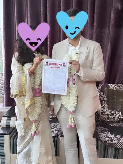 This power couple holds their marriage certificate after a simple and elegant ceremony. I provide legal services for marriage registration at courts like Saket Court.