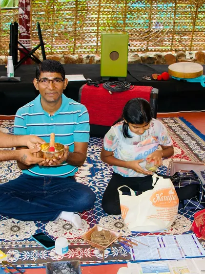 During our Agnihotra ceremony, I offer blessings to a family who joined us. The course is open to everyone, and we often have families learning together.