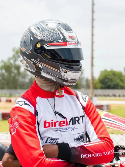 A portrait of our driver, calm and focused. We provide an environment where drivers can mentally prepare to perform at their peak.