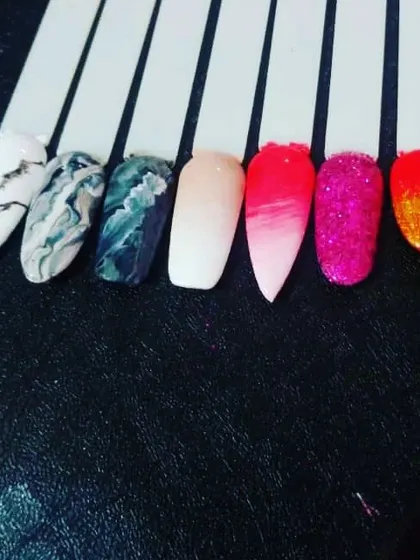 A few sample nail tips to spark your imagination. This shows different techniques like black and white marble, a pink ombre fade, and full-coverage glitter.