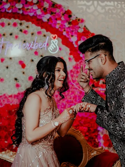A playful, candid interaction between the couple at their engagement. We encourage these fun moments that show your true personalities.
