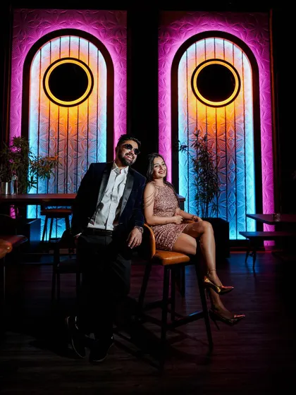 A duplicate of the vibrant, full-color shot of the couple at the bar.