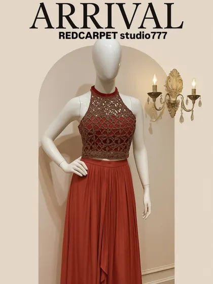 A mannequin showcasing the wine-rose halter neck gown. The detailed, semi-sheer top contrasts beautifully with the simple, elegant drape of the skirt, making it ideal for cocktail parties.