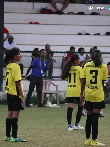 Locked in during a crucial tournament match in Goa. You can see the focus and communication between our players on the field, with spectators watching from the stands. This is what high-stakes football looks like.
