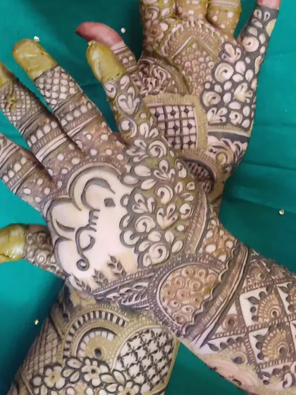 A traditional bridal design featuring an elephant motif, symbolizing good luck and prosperity.
