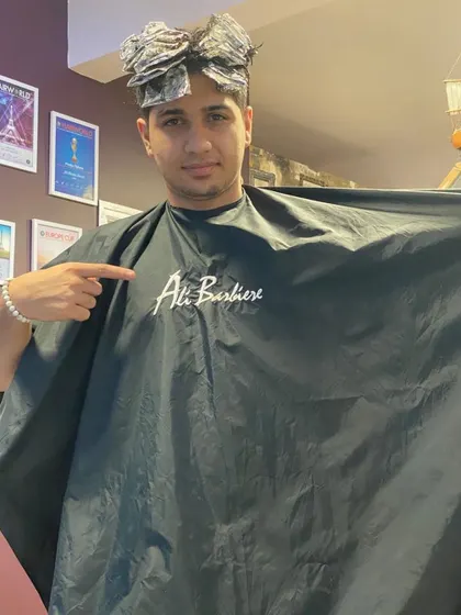 The process shot, showing the foils used to create the precise silver highlights.