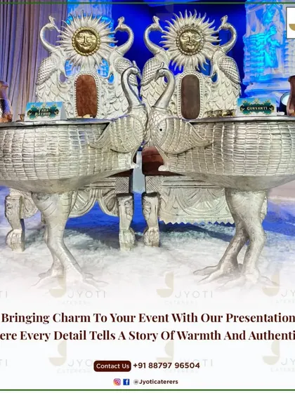 An incredibly ornate silver-carved counter featuring peacock chairs and swan-shaped serving vessels, designed for a truly royal and unforgettable event.
