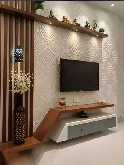 An elegant TV unit featuring a 3D textured wall panel. The asymmetrical design combines a floating console with a vertical wooden element and a display shelf, creating a unique focal point.