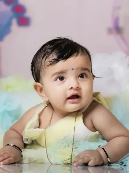 A curious expression from a baby in our candy cart setup. The soft colors and sweet props are simply adorable.