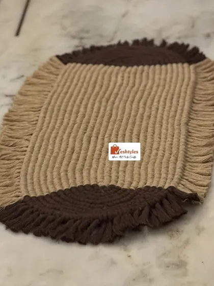 A simple shot of the beige and brown table mat. The design is simple yet elegant, perfect for any dining table or center table.