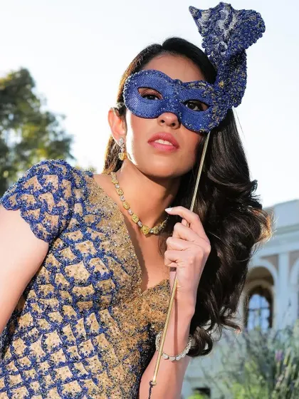 Getting into the spirit of the masquerade ball. The custom Versace gown paired with an ornate mask completed the theme perfectly, blending high fashion with a sense of playfulness.