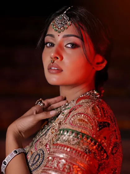 A stunning portrait captured with dramatic red lighting. The makeup holds up beautifully, proving its quality and versatility.