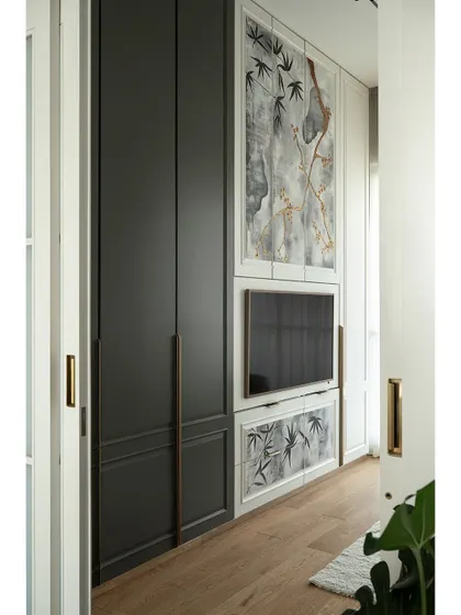 The den room is a perfect example of multi-functional design. The sofa easily converts to a bed, while the custom storage and bar unit ensure the space is always ready for guests or a quiet evening in.
