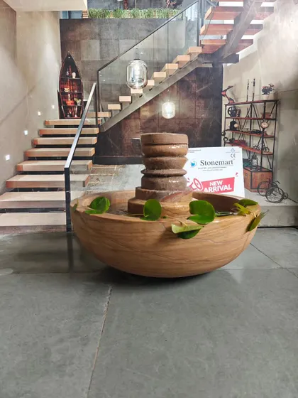 This view shows the scale of the lotus pond fountain against a modern staircase, illustrating how it can complement interior architecture.
