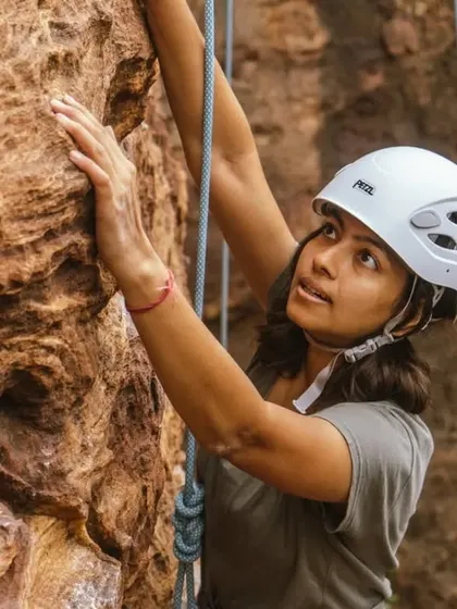 The same climber, now focused and determined. This pairing shows the range of emotions in a single climb: from joy and playfulness to intense concentration.