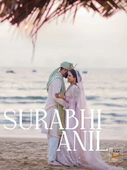An iconic sunset shot of a couple on a Goa beach, capturing the romance of a seaside wedding.