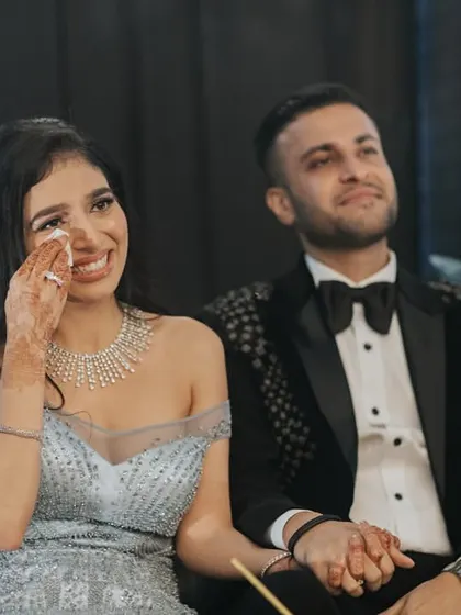 A touching, emotional moment as the bride and groom watch the performances. The sangeet is a journey of emotions, and we capture all of them.