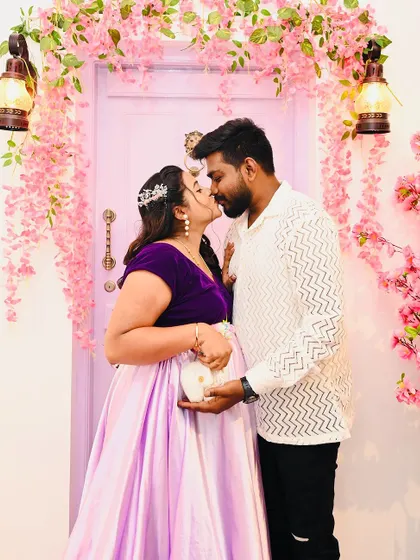 A romantic kiss shared during a maternity shoot in front of our lavender door. This image showcases the love and connection that I strive to capture for every couple.