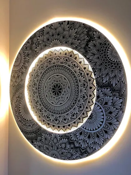 Brighter and better. This backlit mandala is a showstopper, combining detailed freehand drawing with modern lighting to create a truly unique piece of wall decor.