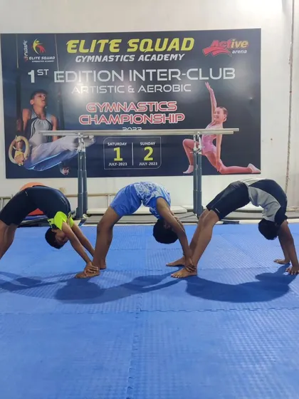 Our boys practicing a three-person back bridge. These recreational movements are great for building strength and flexibility in a collaborative way.