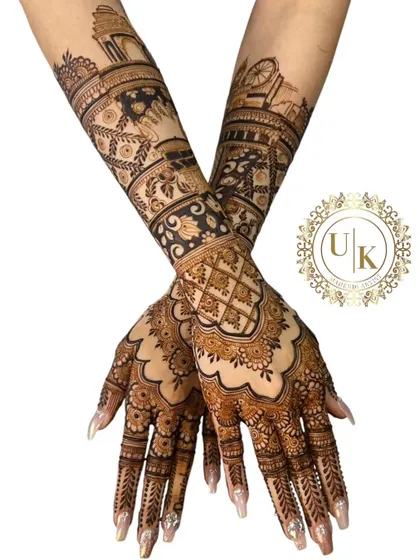 This design showcases a mix of architectural motifs and geometric patterns. It's a modern take on the traditional full-hand bridal mehandi.