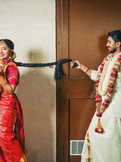 A playful and sweet moment. The groom's simple, elegant look is perfect for these candid shots.