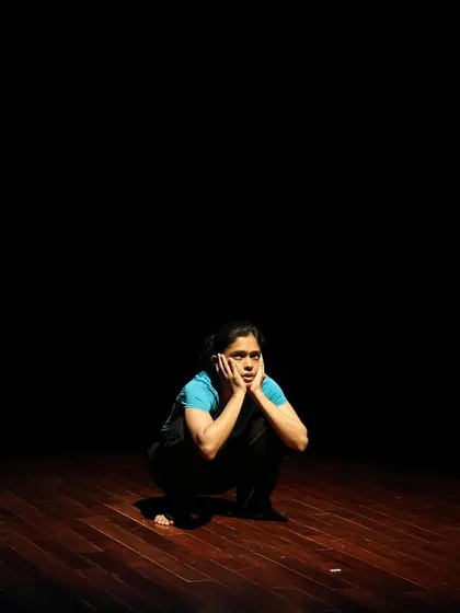 A dancer in a moment of contemplation during a tech run.
