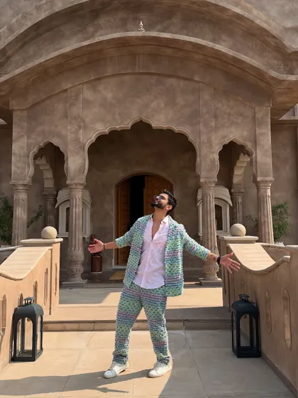 An SRK-inspired pose. It's a tribute to a legend and shows my love for Bollywood.