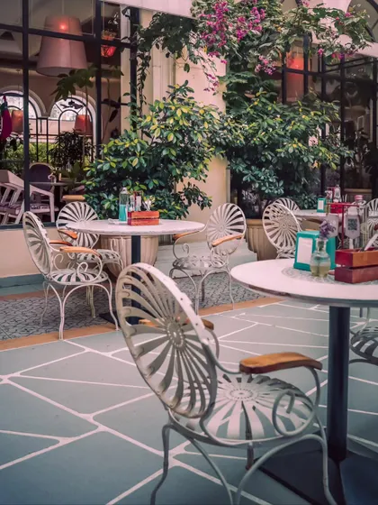 My courtyard offers a charming, European-inspired setting. The stone flooring and classic white wrought-iron furniture are perfect for an elegant outdoor reception, cocktail hour, or a romantic celebration.