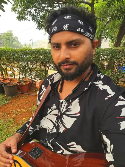 A selfie with my guitar, ready for a jamming session. The bandana look is part of my signature style for certain gigs.