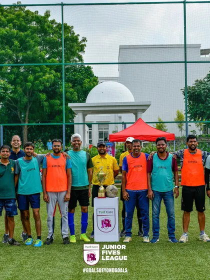 A group of participants, including referees and organizers, pose for a photo. Our events bring people from all walks of life together for the love of football.