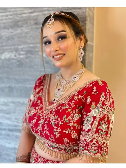 The same client smiling, showing how the makeup looks radiant and beautiful in motion. Perfect for any celebration.