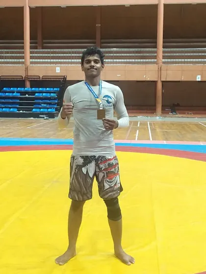Standing on the competition mats in Kerala. Every tournament is a chance to learn and grow.