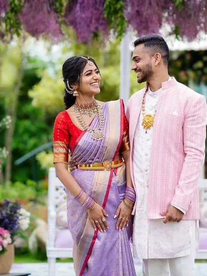 Shreya and Siddhanth sharing a sweet moment at their engagement. Their smiles and the beautiful lilac-themed decor came together perfectly.