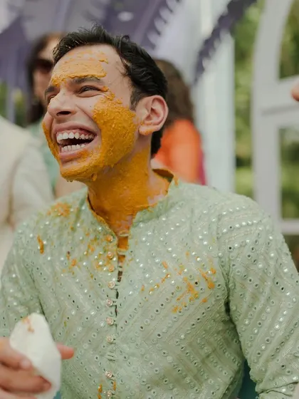 The groom's infectious laughter during his Haldi ceremony. These are the candid moments of pure happiness we love to see.