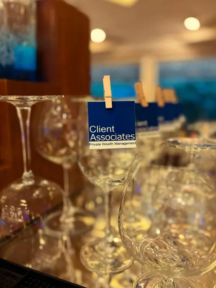 For a corporate event, we created these simple, branded glass tags featuring the "Client Associates" logo. It's a professional and effective way to reinforce branding.