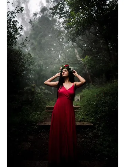 Color version of the model in a red dress and flower crown in a misty forest