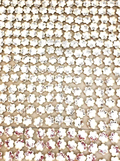 A massive grid of hundreds of Urli candles, showing the scale of my production during the busy Diwali season.