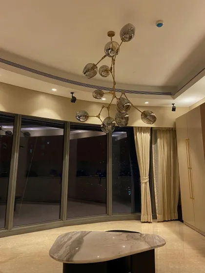 A look at the World View residence, where we installed smart, dimmable lighting. The modern chandelier becomes a centerpiece, with its brightness easily controlled through our system to match any occasion.