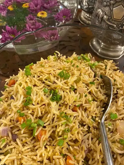 Sometimes, nothing beats a classic Vegetable Fried Rice. Ours is made with fresh, finely chopped vegetables and perfectly cooked long-grain rice, seasoned to perfection.