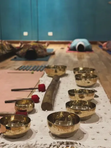 A close-up of the tools of my trade: a collection of Tibetan singing bowls and mallets ready for a session.